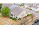 Aerial view of a charming home with a tile roof and landscaped yard at 20835 E 47Th Ave, Denver, CO 80249