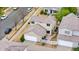 A tan home featuring a tile roof, attached garage, and fenced backyard patio at 20835 E 47Th Ave, Denver, CO 80249