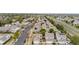 A neighborhood with similar homes, green trees and solar panels on several roofs at 20835 E 47Th Ave, Denver, CO 80249
