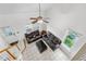 Living area featuring tile floors, dual sofas, and abundant natural light at 20835 E 47Th Ave, Denver, CO 80249