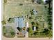 Drone shot of home on a large lot with a garden, shed, trampoline, and other storage buildings at 1866 Mountain View St, Erie, CO 80516