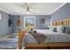 Serene bedroom featuring a ceiling fan, a plush rug, and ample natural light at 1866 Mountain View St, Erie, CO 80516