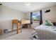 Bedroom with a bunk bed and twin bed featuring dino themed decor at 1866 Mountain View St, Erie, CO 80516