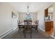 Charming dining room with hardwood furniture, natural light, and an inviting atmosphere at 1866 Mountain View St, Erie, CO 80516