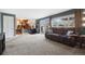 Open living area with a walkout and adjoins the kitchen and office space at 1866 Mountain View St, Erie, CO 80516