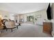 Open-concept living room featuring a large bay window and cozy seating at 1866 Mountain View St, Erie, CO 80516