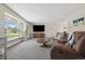 Bright and airy living room boasting a large bay window and comfortable seating arrangement at 1866 Mountain View St, Erie, CO 80516