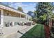 Inviting backyard with patio seating and well-maintained artificial grass at 4720 S Dudley St # 38, Littleton, CO 80123