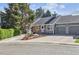 Charming townhome with stone accents, well-kept landscaping, and a two-car garage at 4720 S Dudley St # 38, Littleton, CO 80123