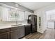 Well-lit kitchen with stainless-steel appliances, modern countertops, and stylish backsplash at 4720 S Dudley St # 38, Littleton, CO 80123