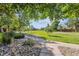 Picturesque park with walking paths, lush greenery, and mature trees at 4720 S Dudley St # 38, Littleton, CO 80123