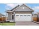 Charming single-Gathering home with a two-car garage and inviting front porch at 9444 Yampa St, Commerce City, CO 80022