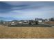 Community playground with play structure and swings with homes and picnic pavilion in the background at 9444 Yampa St, Commerce City, CO 80022