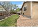A landscaped backyard with a well-maintained lawn, perfect for outdoor relaxation or entertaining at 420 Graham Cir, Erie, CO 80516