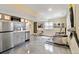Finished basement with kitchenette, seating area, dining area, and airplane propeller decoration at 420 Graham Cir, Erie, CO 80516