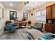 Retro basement with listening area, funky lighting, record player, and vintage furniture at 420 Graham Cir, Erie, CO 80516