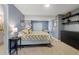 Spacious bedroom with gray walls, neutral carpet, and a large window for natural light at 420 Graham Cir, Erie, CO 80516