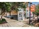 Corner bistro with outdoor seating, surrounded by lush greenery and charming streetscape details in a downtown setting at 420 Graham Cir, Erie, CO 80516
