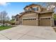 Charming two-story home featuring a three-car garage and well-maintained front yard at 420 Graham Cir, Erie, CO 80516