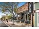 Charming bistro featuring brick facade, large windows, and inviting outdoor seating in a downtown setting at 420 Graham Cir, Erie, CO 80516