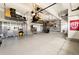 Well-organized garage with epoxy floor, storage cabinets and upper storage racks at 420 Graham Cir, Erie, CO 80516