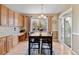 Inviting eat-in kitchen with a dining table, granite countertops, and ample cabinet space at 420 Graham Cir, Erie, CO 80516
