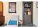 A cozy seating area featuring a built-in cabinet and shelves, perfect for relaxing or entertaining at 420 Graham Cir, Erie, CO 80516