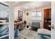 Home office or flex space with built-in storage, vintage furnishings, and ample natural light at 420 Graham Cir, Erie, CO 80516