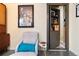 Sitting room with a Dave Brubeck poster and a hidden bookshelf door at 420 Graham Cir, Erie, CO 80516
