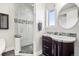 Modern bathroom featuring a glass shower and stylish vanity with mosaic tile accents at 10177 Rancho Montecito Dr, Parker, CO 80138