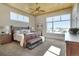 Bright bedroom with wood ceiling, large windows offering scenic views, and stylish decor at 10177 Rancho Montecito Dr, Parker, CO 80138