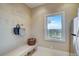 Functional mudroom with bench seating, hooks, and a window with pleasant views at 10177 Rancho Montecito Dr, Parker, CO 80138