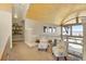 Cozy sitting area with wood-paneled ceiling, lots of natural light, and comfortable seating at 10177 Rancho Montecito Dr, Parker, CO 80138