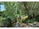 Picturesque view of a gentle creek flowing through a lush green landscape, creating a serene natural setting at 5250 S Huron Way # 5-308, Littleton, CO 80120
