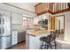 Cozy kitchen with stainless appliances, light countertops and seating at the breakfast bar at 5250 S Huron Way # 5-308, Littleton, CO 80120