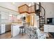 The kitchen has stainless appliances and there is a spiral staircase that provides access to an upper level at 5250 S Huron Way # 5-308, Littleton, CO 80120