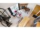 Airy open-concept living room showcasing a stone fireplace, spiral staircase, and wood accents at 5250 S Huron Way # 5-308, Littleton, CO 80120