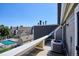 Balcony view showcasing the condo complex with a pool, trees, and adjacent buildings at 5250 S Huron Way # 5-308, Littleton, CO 80120