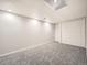 Finished basement area with carpet and access to a closet at 9670 W 69Th Ave, Arvada, CO 80004