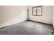 Cozy bedroom with neutral carpet and a window that provides natural light at 9670 W 69Th Ave, Arvada, CO 80004