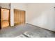 Bedroom featuring neutral carpet, a window, and a large closet at 9670 W 69Th Ave, Arvada, CO 80004