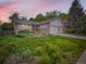 Charming home featuring a well-maintained lawn and beautiful landscaping at 9670 W 69Th Ave, Arvada, CO 80004