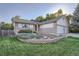 Traditional front exterior showcasing a well-kept lawn and three car garage at 9670 W 69Th Ave, Arvada, CO 80004
