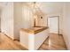 Bright hallway with gleaming hardwood floors and natural light at 9670 W 69Th Ave, Arvada, CO 80004
