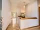 Elegant entryway with hardwood floors and open view to dining and living spaces at 9670 W 69Th Ave, Arvada, CO 80004