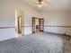 Bright living room with high ceilings, wood trim, and french doors to the fireplace at 9670 W 69Th Ave, Arvada, CO 80004