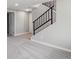 Renovated basement area with staircase featuring iron railing at 13051 W Jewell Cir, Lakewood, CO 80228