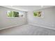 Spacious bedroom with new carpet, recessed lighting, and multiple windows at 13051 W Jewell Cir, Lakewood, CO 80228