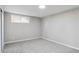 Cozy bedroom with plush carpet and a bright window for natural light at 13051 W Jewell Cir, Lakewood, CO 80228