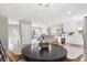 Open-concept layout featuring kitchen, dining and living space for seamless entertaining at 13051 W Jewell Cir, Lakewood, CO 80228